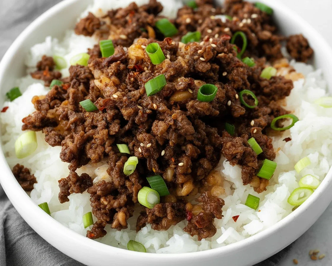 Delicious one-pan ground beef stir fry with colorful vegetables and rice.